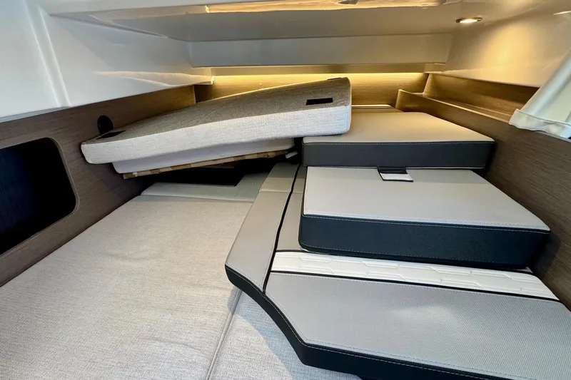  Yacht Photos Pics 2024 Jeanneau NC 1095 Coupe Series 2 cabin interior with adjustable cushions.