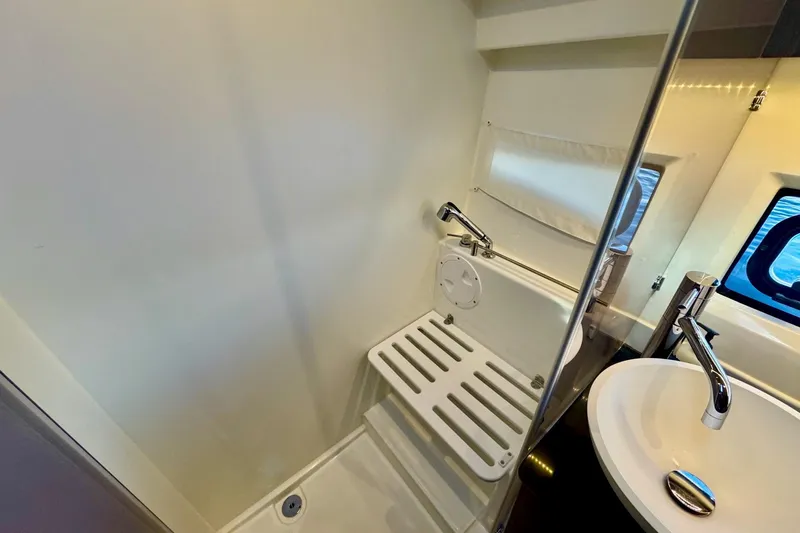  Yacht Photos Pics 2024 Jeanneau NC 1095 Coupe Series 2 bathroom with shower and sink.