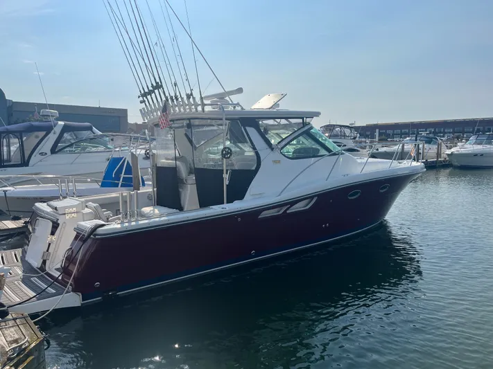 Papa Joe Yacht Photos Pics 2006 Tiara Yachts 3600 Open docked in a marina, featuring fishing rods and sleek design.