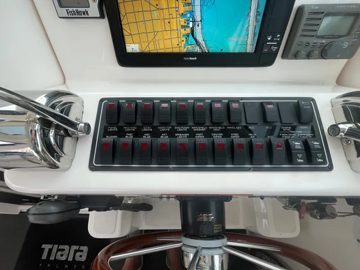 Papa Joe Yacht Photos Pics Control panel of a 2006 Tiara Yachts 3600 Open with navigation and switchboard.
