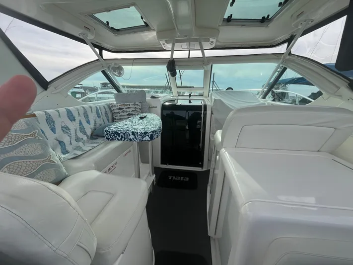 Papa Joe Yacht Photos Pics 2006 Tiara Yachts 3600 Open interior with white seating and patterned cushions.
