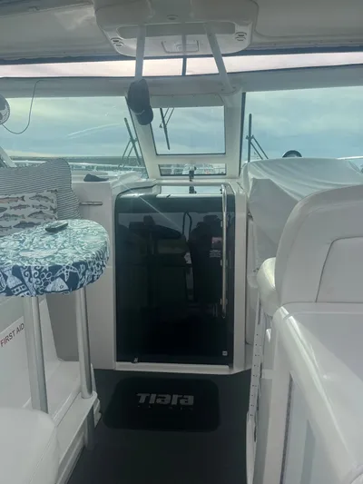 Papa Joe Yacht Photos Pics Interior view of 2006 Tiara Yachts 3600 Open, featuring helm and seating area.