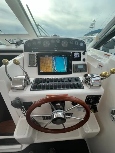 Papa Joe Yacht Photos Pics Helm of 2006 Tiara Yachts 3600 Open with navigation controls and steering wheel.