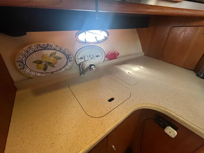 Papa Joe Yacht Photos Pics 2006 Tiara Yachts 3600 Open kitchen area with sink and decorative plates.