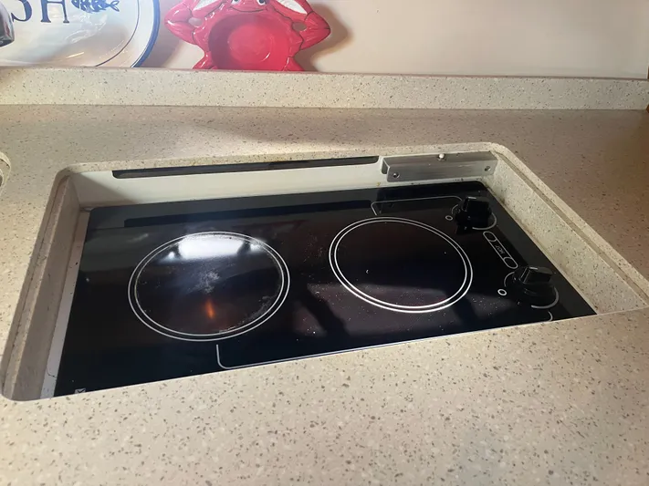 Papa Joe Yacht Photos Pics Electric stove in 2006 Tiara Yachts 3600 Open galley, featuring two burners.