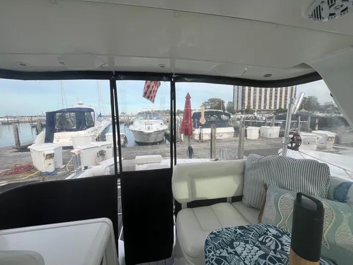 Papa Joe Yacht Photos Pics Interior view of 2006 Tiara Yachts 3600 Open, docked at a marina with other boats.