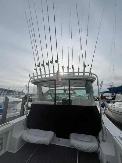 Papa Joe Yacht Photos Pics 2006 Tiara Yachts 3600 Open with fishing rods, docked at marina.