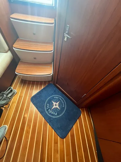 Papa Joe Yacht Photos Pics Interior of 2006 Tiara Yachts 3600 Open with wooden flooring and steps.