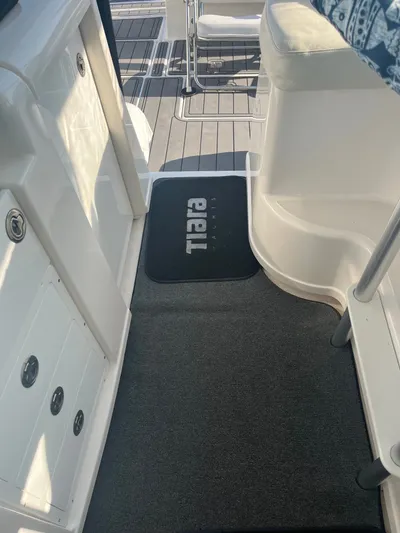 Papa Joe Yacht Photos Pics 2006 Tiara Yachts 3600 Open interior with branded mat and seating area.