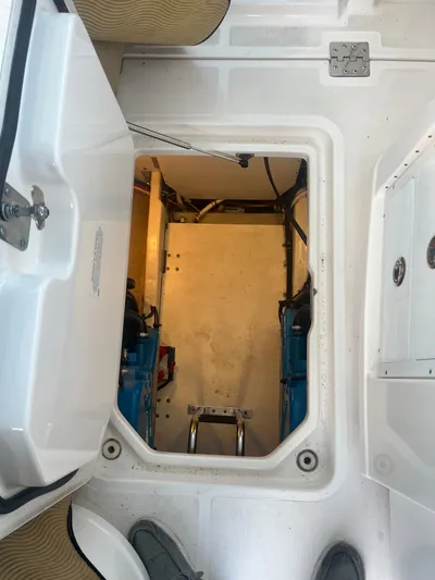 Papa Joe Yacht Photos Pics Engine compartment of 2006 Tiara Yachts 3600 Open, showcasing interior access and components.