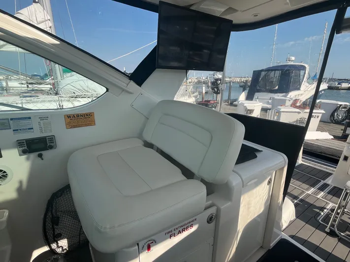 Papa Joe Yacht Photos Pics 2006 Tiara Yachts 3600 Open interior with helm seat and marina view.