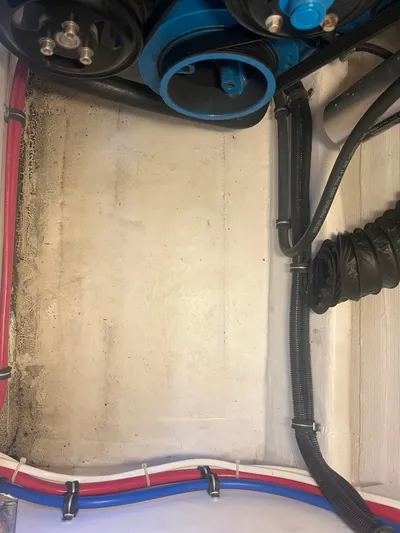 Papa Joe Yacht Photos Pics Engine compartment of a 2006 Tiara Yachts 3600 Open, showing cables and hoses.