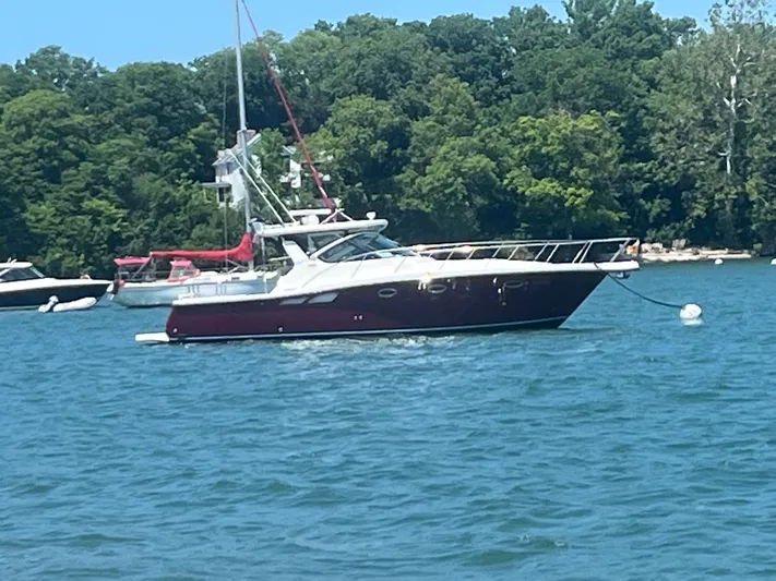 Papa Joe Yacht Photos Pics 2006 Tiara Yachts 3600 Open on water, surrounded by trees and other boats.