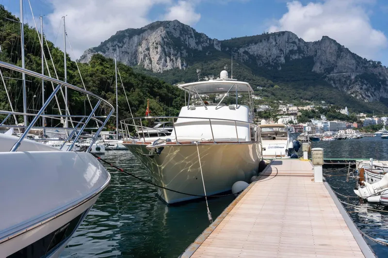  Yacht Photos Pics 2006 Vicem 54 Classic Flybridge yacht docked in scenic marina with mountains.