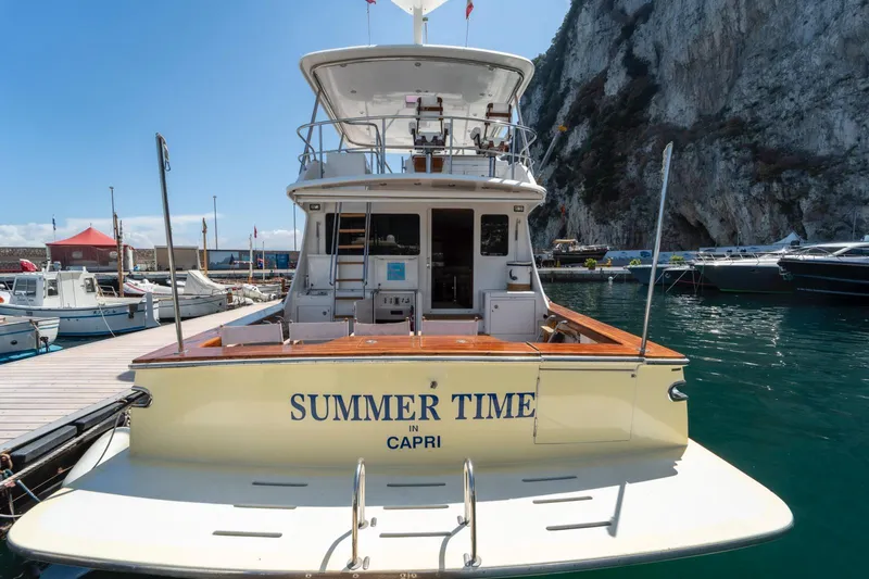  Yacht Photos Pics 2006 Vicem 54 Classic Flybridge yacht docked, named "Summer Time," in a scenic marina.