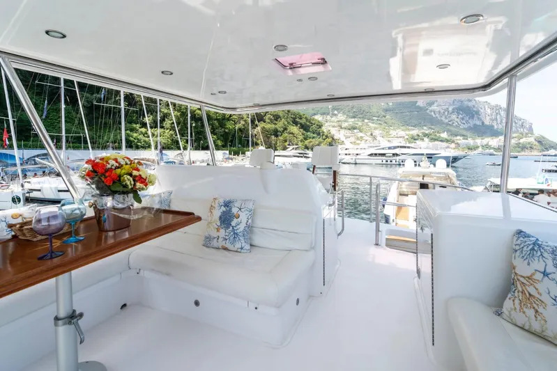  Yacht Photos Pics Luxurious 2006 Vicem 54 Classic Flybridge yacht interior with elegant seating and scenic marina view.