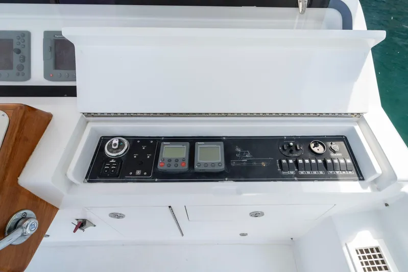  Yacht Photos Pics Control panel of 2006 Vicem 54 Classic Flybridge yacht, featuring navigation and engine controls.