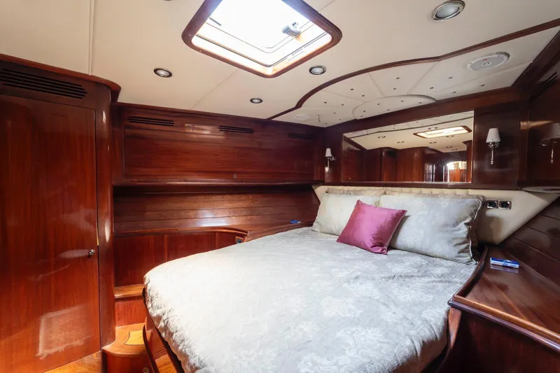  Yacht Photos Pics Luxurious cabin interior of 2006 Vicem 54 Classic Flybridge yacht with elegant wood finish.
