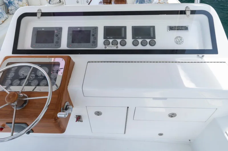  Yacht Photos Pics Helm of 2006 Vicem 54 Classic Flybridge with navigation instruments and steering wheel.