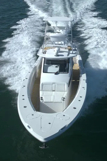 New! Hybrid Design Yacht Photos Pics 2025 Century NAV4100 CC-H boat cruising on open water, showcasing sleek design and performance.