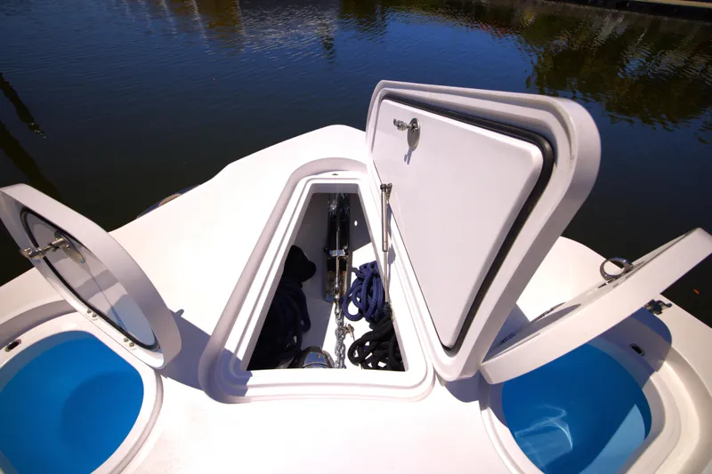 New! Hybrid Design Yacht Photos Pics 2025 Century NAV4100 CC-H boat storage compartments open on calm water.