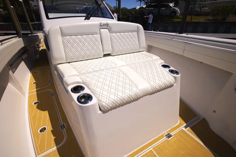 New! Hybrid Design Yacht Photos Pics Luxurious seating on 2025 Century NAV4100 CC-H boat with quilted upholstery and cup holders.