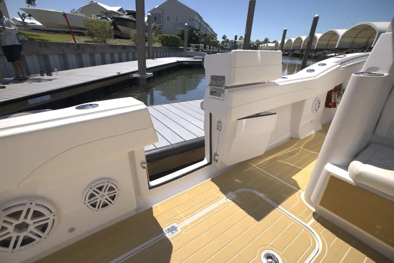 New! Hybrid Design Yacht Photos Pics 2025 Century NAV4100 CC-H boat interior with open side door, docked at marina.