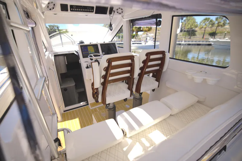 New! Hybrid Design Yacht Photos Pics Interior of 2025 Century NAV4100 CC-H boat with twin seats and modern controls.