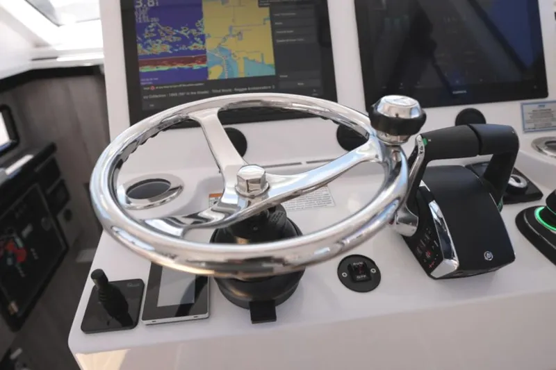New! Hybrid Design Yacht Photos Pics Steering wheel and controls of 2025 Century NAV4100 CC-H boat with navigation screens.