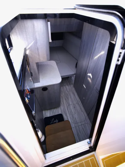 New! Hybrid Design Yacht Photos Pics Interior view of 2025 Century NAV4100 CC-H boat cabin, featuring modern design and compact layout.