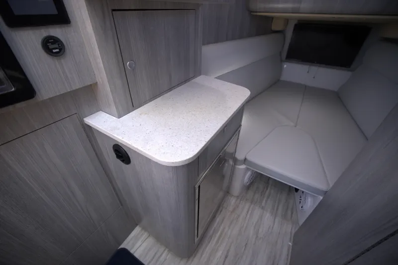 New! Hybrid Design Yacht Photos Pics Interior of 2025 Century NAV4100 CC-H boat, featuring modern cabinetry and seating.