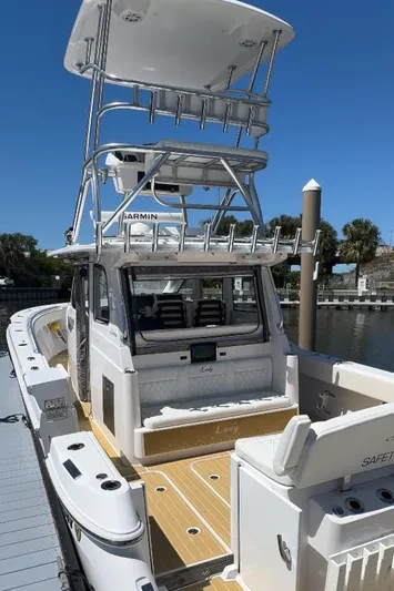 New! Hybrid Design Yacht Photos Pics 2025 Century NAV4100 CC-H boat docked, featuring spacious deck and modern design.