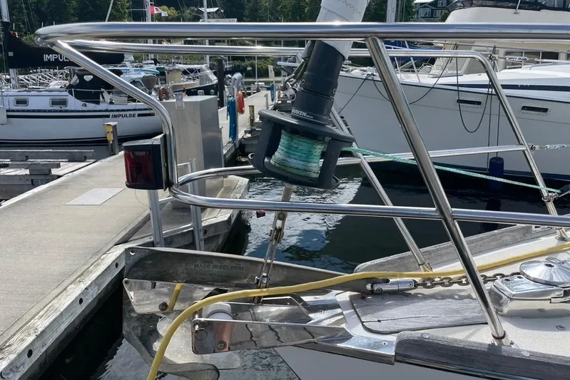 "snapdragon" Yacht Photos Pics Bow of a 1999 Tartan 4100 sailboat with winch and railing at marina.
