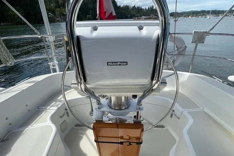"snapdragon" Yacht Photos Pics Cockpit of 1999 Tartan 4100 sailboat with NavPod, docked by a scenic lake.