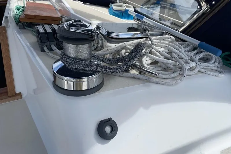 "snapdragon" Yacht Photos Pics Deck of 1999 Tartan 4100 sailboat with winch, ropes, and cleaning brush.