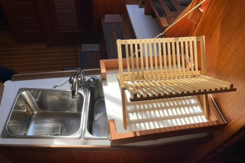 "snapdragon" Yacht Photos Pics Kitchen sink and drying rack in 1999 Tartan 4100 yacht interior.