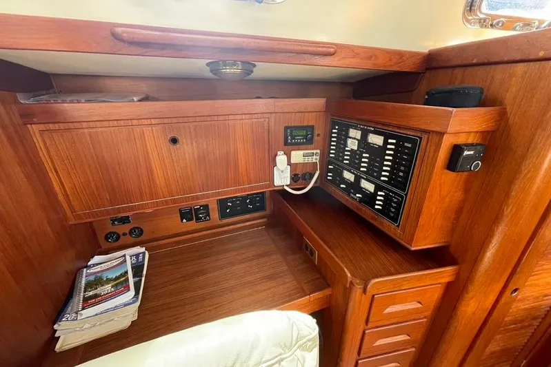 "snapdragon" Yacht Photos Pics 1999 Tartan 4100 yacht interior with wooden cabinetry and control panel.