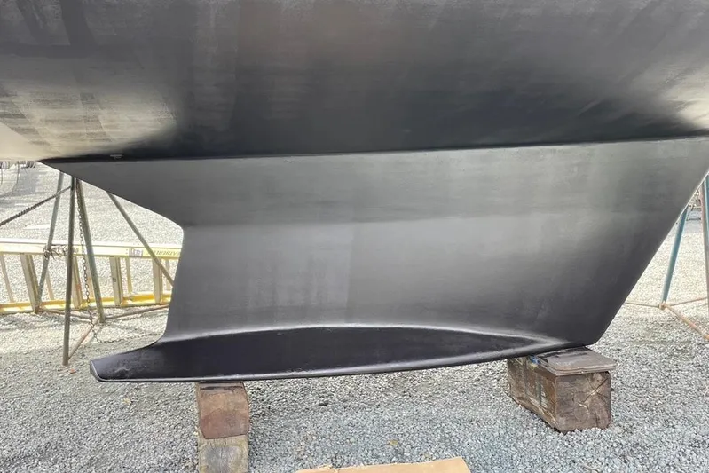 "snapdragon" Yacht Photos Pics 1999 Tartan 4100 sailboat keel on stands, displayed outdoors.