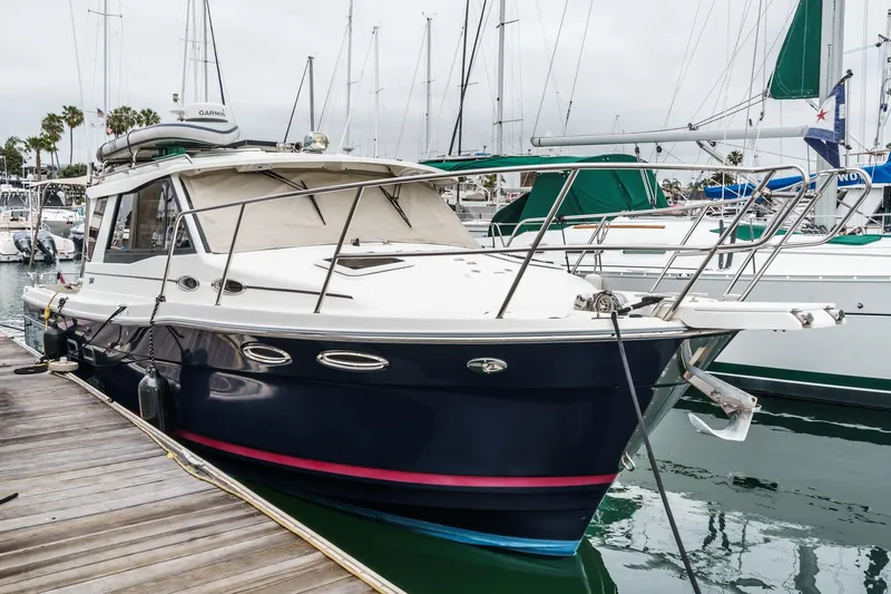 C-worthy III Yacht Photos Pics 2014 Cutwater C-30 SC LE boat docked at marina, surrounded by other vessels.