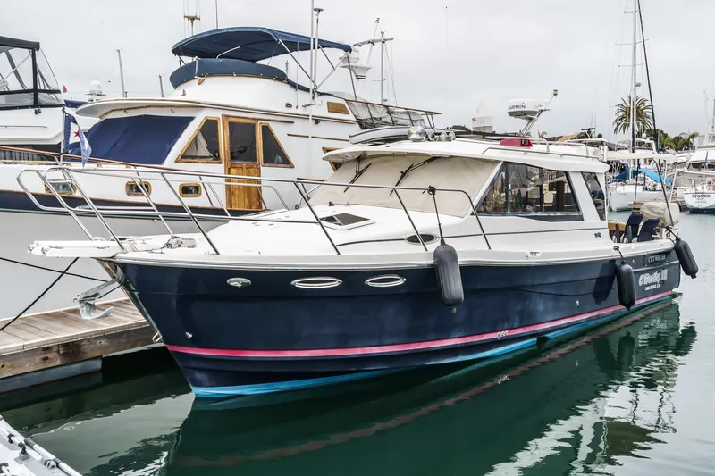 C-worthy III Yacht Photos Pics 2014 Cutwater C-30 SC LE boat docked at marina, featuring sleek design and blue hull.