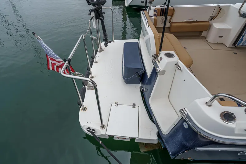 C-worthy III Yacht Photos Pics 2014 Cutwater C-30 SC LE boat stern with American flag and seating area.
