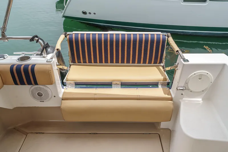 C-worthy III Yacht Photos Pics 2014 Cutwater C-30 SC LE boat seating area with striped cushions and beige upholstery.