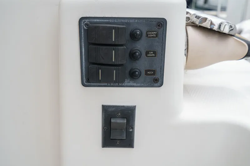 C-worthy III Yacht Photos Pics Control panel on 2014 Cutwater C-30 SC LE boat, featuring switches and buttons.