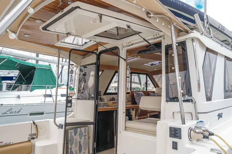 C-worthy III Yacht Photos Pics 2014 Cutwater C-30 SC LE boat interior with open doors and seating area.