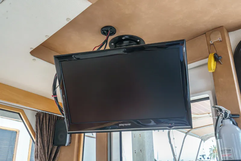 C-worthy III Yacht Photos Pics Ceiling-mounted TV inside 2014 Cutwater C-30 SC LE boat interior.