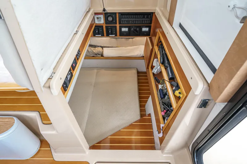 C-worthy III Yacht Photos Pics 2014 Cutwater C-30 SC LE cabin interior with control panels and storage compartments.