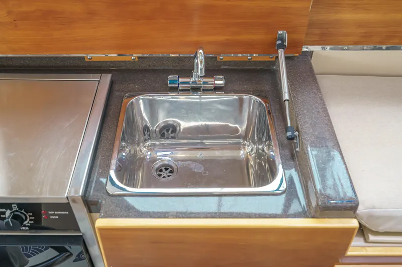 C-worthy III Yacht Photos Pics 2014 Cutwater C-30 SC LE kitchen sink with stainless steel finish and modern faucet.
