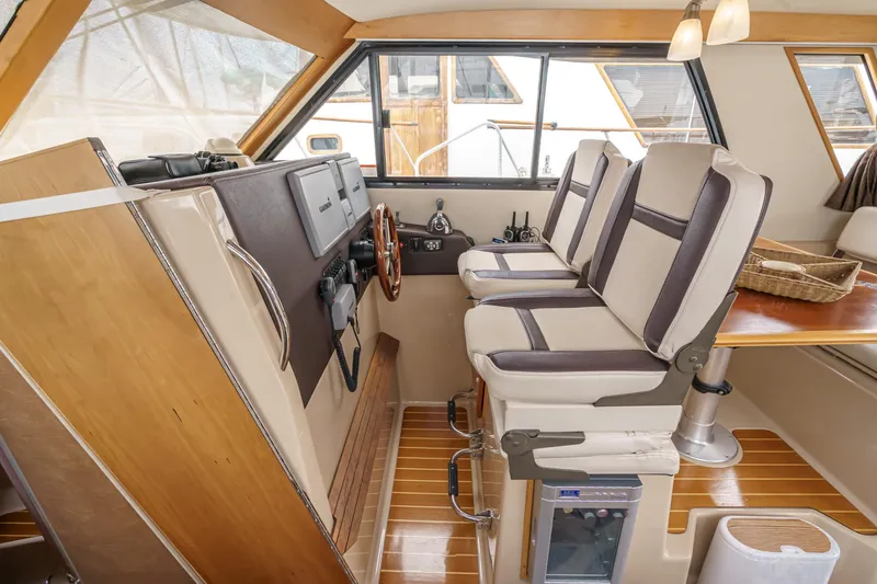 C-worthy III Yacht Photos Pics Interior of 2014 Cutwater C-30 SC LE boat with helm and seating area.