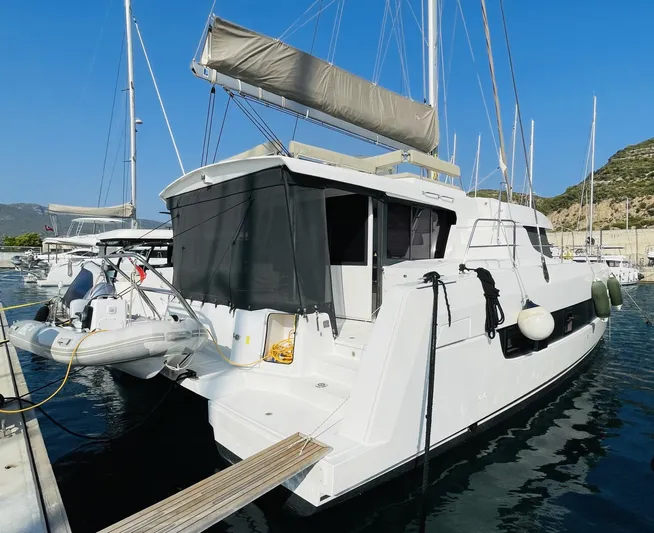  Yacht Photos Pics 2022 Bali 4.4 catamaran docked at marina, featuring sleek design and modern amenities.