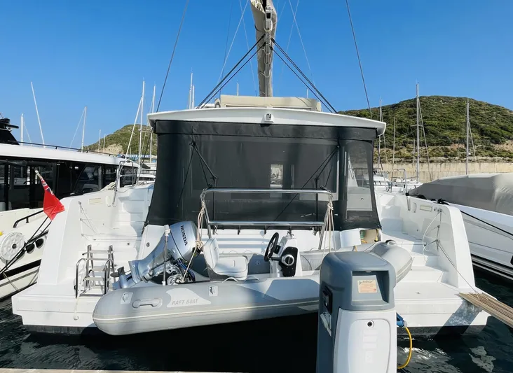  Yacht Photos Pics 2022 Bali 4.4 catamaran docked with inflatable raft and Honda motor.